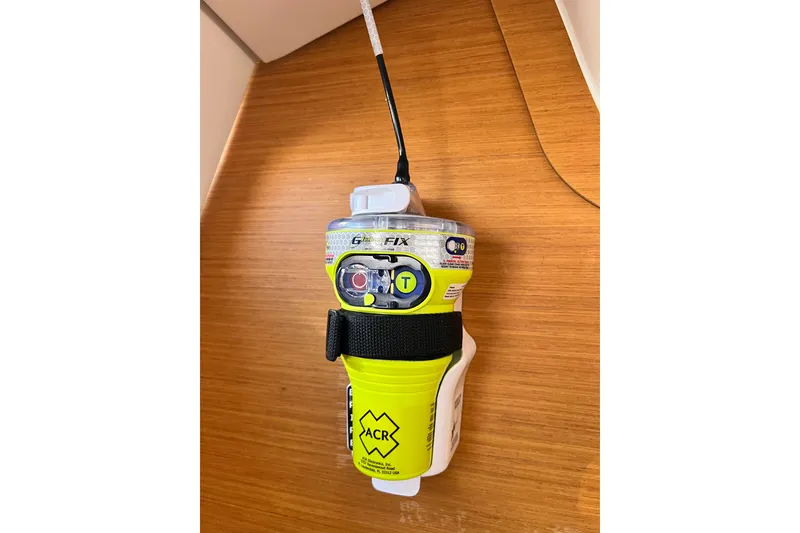 Slide: The Image of Yellow ACR emergency beacon mounted on a Jeanneau 54 yacht, 2018 model. - 67