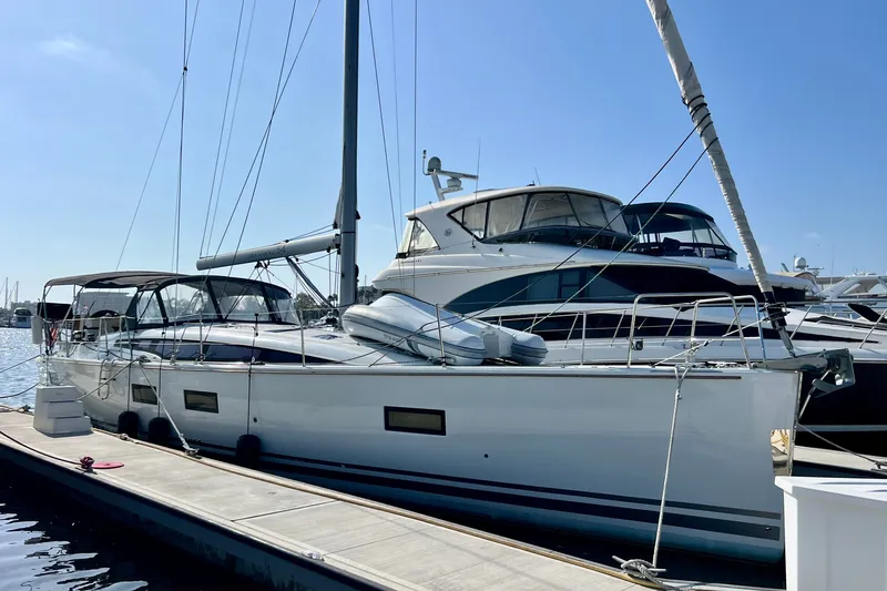 Slide: The Image of 2018 Jeanneau 54 yacht docked at marina, clear sky, luxury sailing vessel. - 15