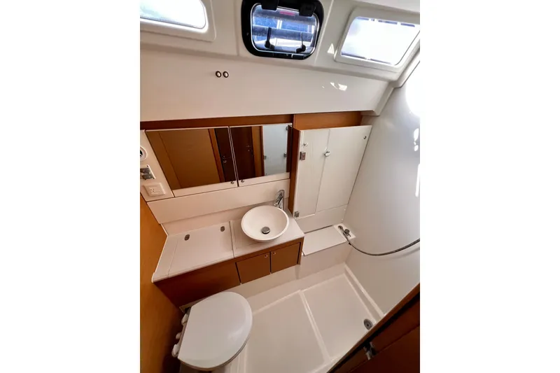 Slide: The Image of Bathroom interior of 2018 Jeanneau 54 yacht, featuring modern fixtures and ample natural light. - 96