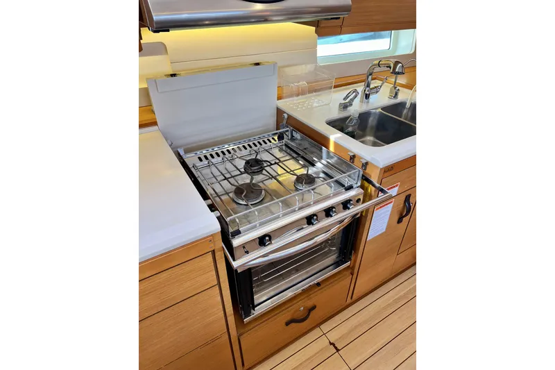 Slide: The Image of Modern kitchen in 2018 Jeanneau 54 yacht with stove and sink. - 46