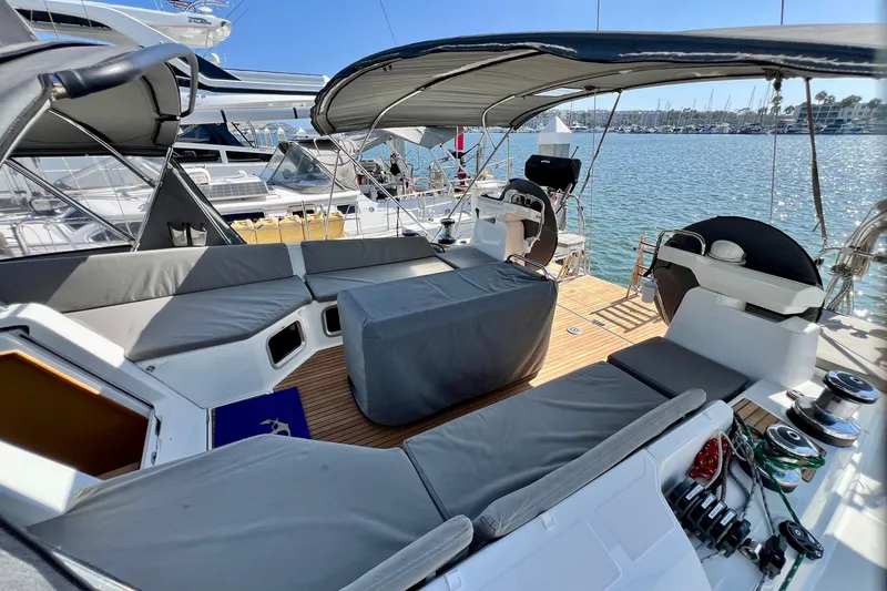 Slide: The Image of Spacious deck of 2018 Jeanneau 54 yacht with comfortable seating and canopy. - 25