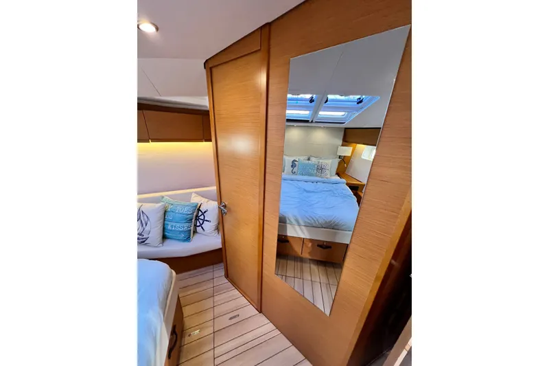 Slide: The Image of Luxurious interior of 2018 Jeanneau 54 yacht with cozy bedroom and stylish decor. - 78