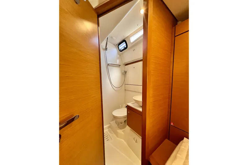 Slide: The Image of Interior of 2018 Jeanneau 54 yacht bathroom with modern fixtures and wooden accents. - 87