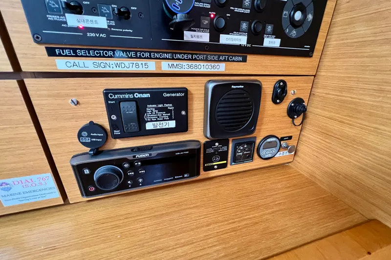 Slide: The Image of Control panel of a 2018 Jeanneau 54 yacht with various electronic devices and labels. - 65