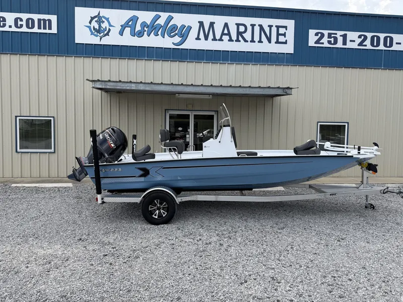 The Image of A 2027 Xpress H20 Bay boat on a trailer in front of a building with "Ashley Marine" signage. - 1