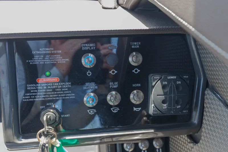 Slide: The Image of Dashboard of a 2016 Sea Ray SLX 250 with various controls and switches. - 10