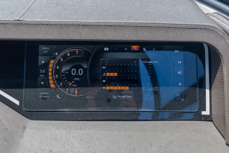 Slide: The Image of The image shows the dashboard of a 2016 Sea Ray SLX 250 boat with digital displays. - 9