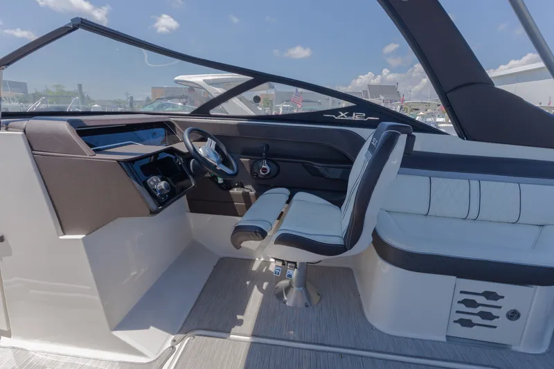 Slide: The Image of The image shows the cockpit of a 2016 Sea Ray SLX 250 with a sleek helm station. - 3