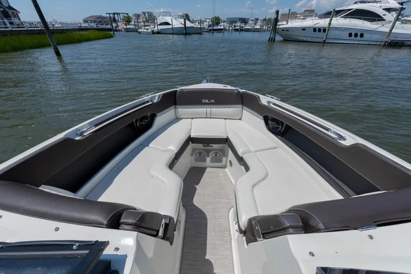 Slide: The Image of The image shows the bow seating area of a 2016 Sea Ray SLX 250 boat. - 6