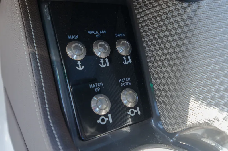 Slide: The Image of Close-up of a control panel with buttons for anchor and hatch operations. - 12