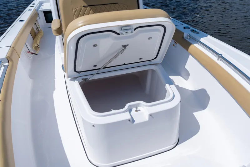 Slide: The Image of 2024 Sportsman Masters 247OE Bay Boat with open storage compartment on deck. - 16