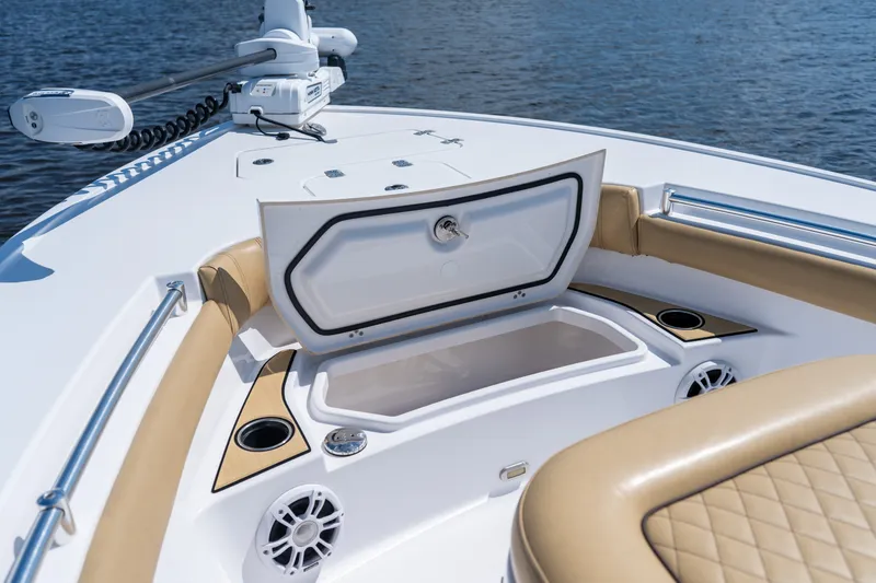 Slide: The Image of 2024 Sportsman Masters 247OE Bay Boat interior with open storage compartment. - 8
