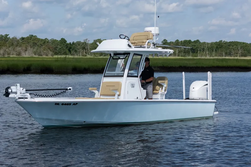 Slide: The Image of 2024 Sportsman Masters 247OE Bay Boat on calm water, featuring modern design and advanced equipment. - 3