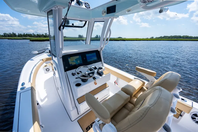 Slide: The Image of 2024 Sportsman Masters 247OE Bay Boat interior with dual seats and advanced navigation system. - 14