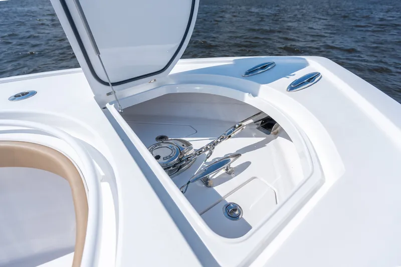 Slide: The Image of 2023 Valhalla Boatworks V-37 anchor compartment with open hatch, on calm water. - 13