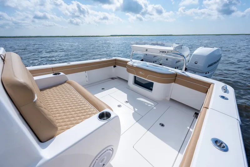 Slide: The Image of 2023 Valhalla Boatworks V-37 with luxurious seating and powerful engines on open water. - 28