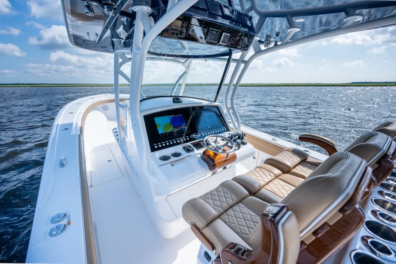 Slide: The Image of 2023 Valhalla Boatworks V-37 helm with advanced navigation system on open water. - 20