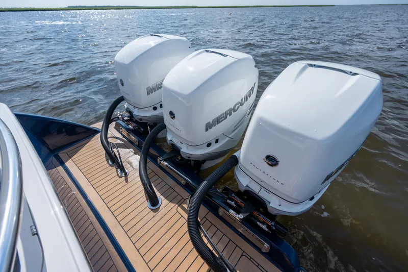 Slide: The Image of 2023 Valhalla Boatworks V-37 with triple Mercury outboard engines on water. - 36