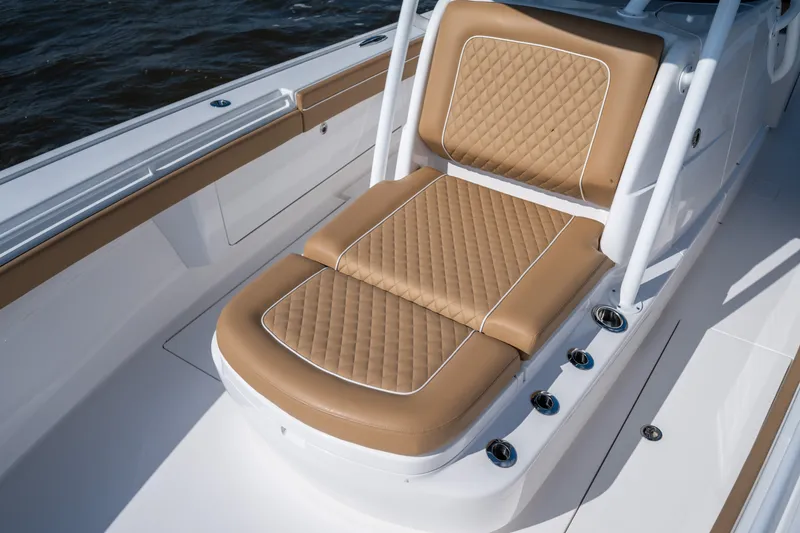 Slide: The Image of Luxurious seating on 2023 Valhalla Boatworks V-37, featuring tan quilted upholstery. - 16