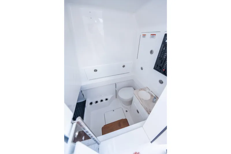 Slide: The Image of Interior of a Valhalla V-37 featuring a toilet and control panel. - 37