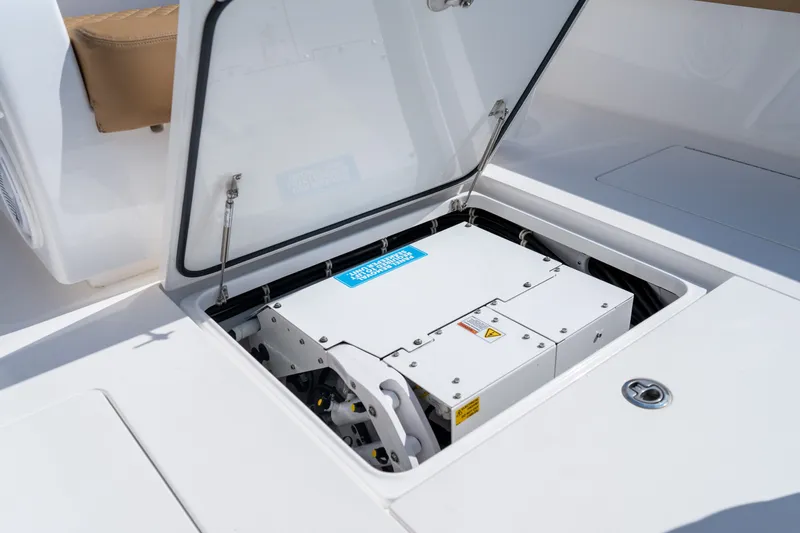 Slide: The Image of 2023 Valhalla Boatworks V-37 storage compartment with open hatch, showcasing internal equipment. - 33