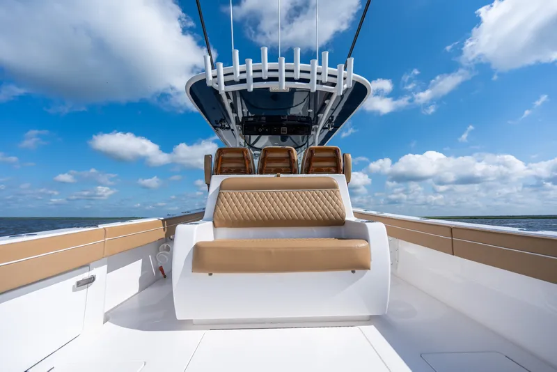 Slide: The Image of 2023 Valhalla Boatworks V-37 interior with tan seating under blue sky. - 34