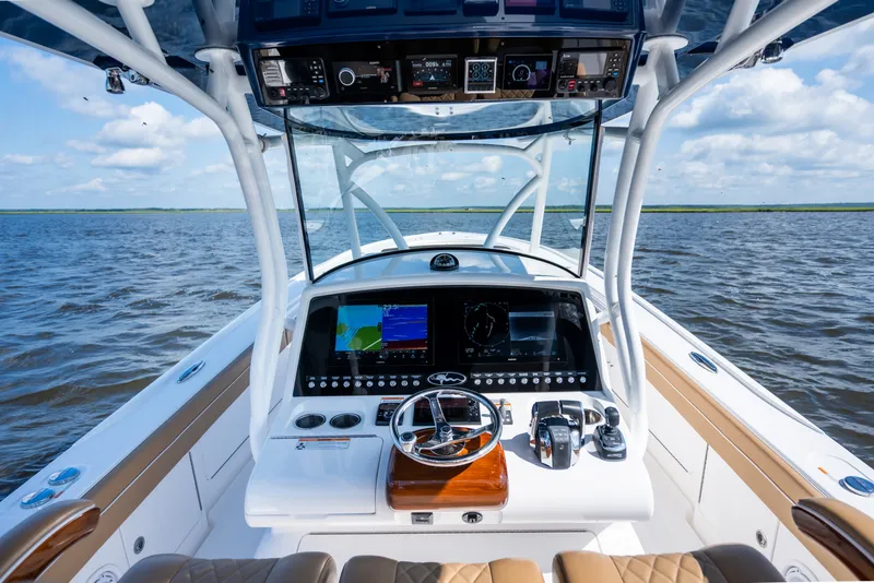 Slide: The Image of 2023 Valhalla Boatworks V-37 helm with advanced navigation system on open water. - 21