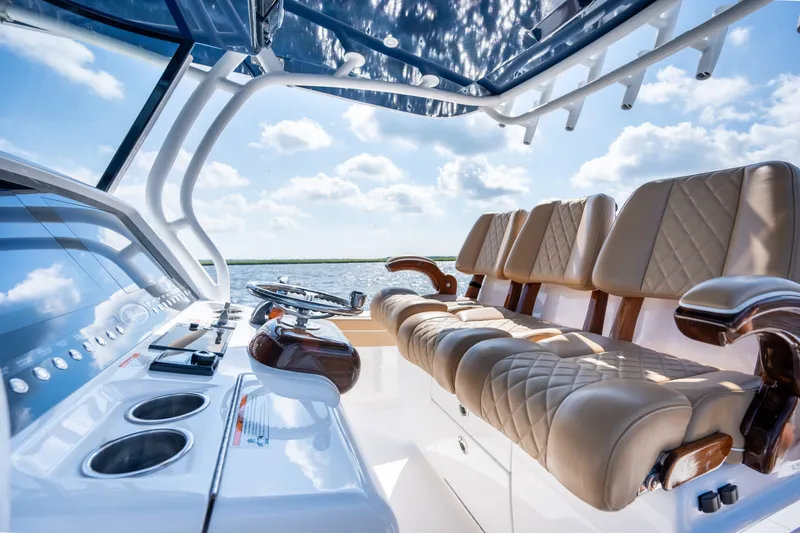 Slide: The Image of 2023 Valhalla Boatworks V-37 interior with luxurious seating and modern helm controls. - 26