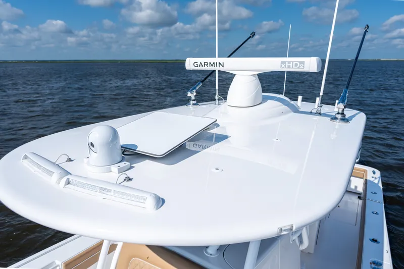 Slide: The Image of 2023 Valhalla Boatworks V-37 with Garmin radar on open water under blue sky. - 27