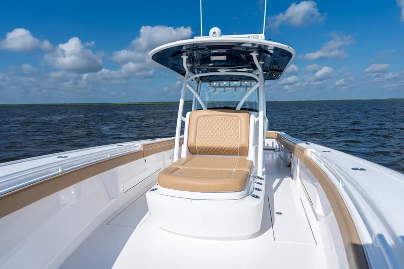 Slide: The Image of 2023 Valhalla Boatworks V-37 on open water, featuring luxurious seating and sleek design. - 15