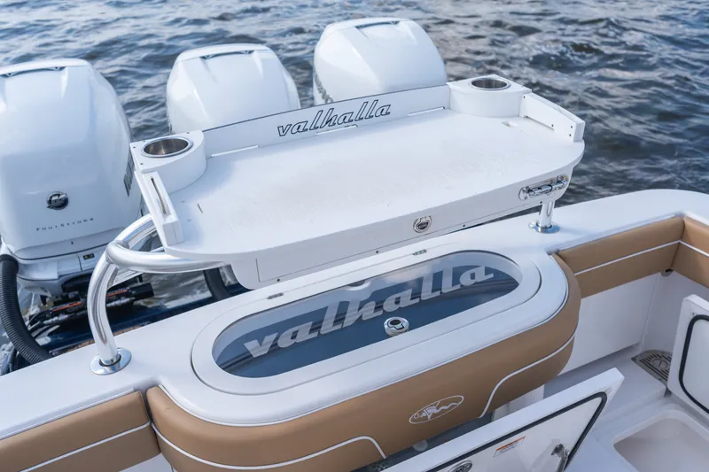 Slide: The Image of 2023 Valhalla Boatworks V-37 with triple engines and sleek deck design on water. - 35