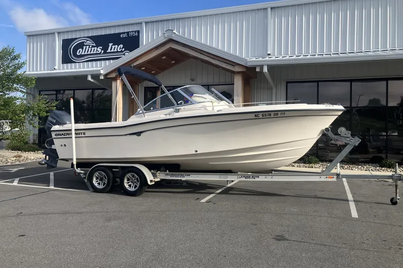 The Image of 2005 Grady-White Tournament 225 boat on trailer outside Collins Inc. building. - 1