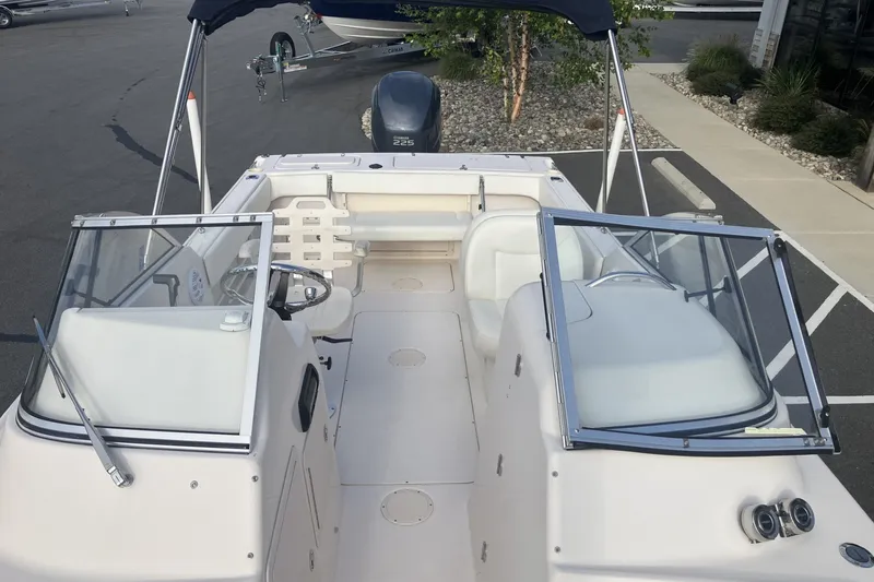 Slide: The Image of 2005 Grady-White Tournament 225 boat interior with seating and steering wheel. - 10