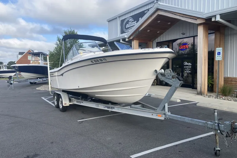 Slide: The Image of 2005 Grady-White Tournament 225 boat on trailer outside dealership. - 4