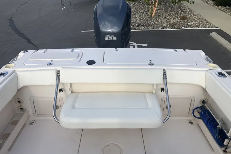 Slide: The Image of 2005 Grady-White Tournament 225 boat interior with Yamaha 225 engine, featuring seating and storage. - 14
