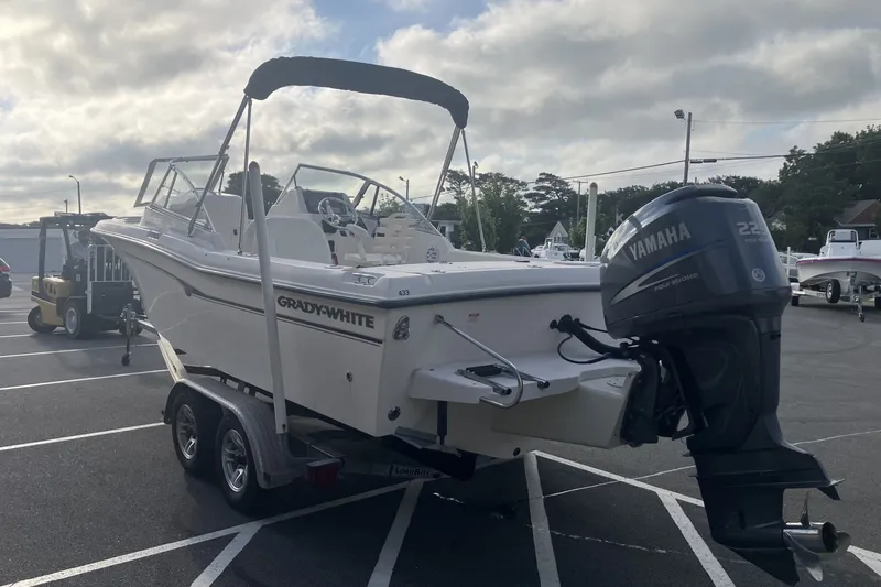 Slide: The Image of 2005 Grady-White Tournament 225 boat with Yamaha engine on trailer in parking lot. - 7