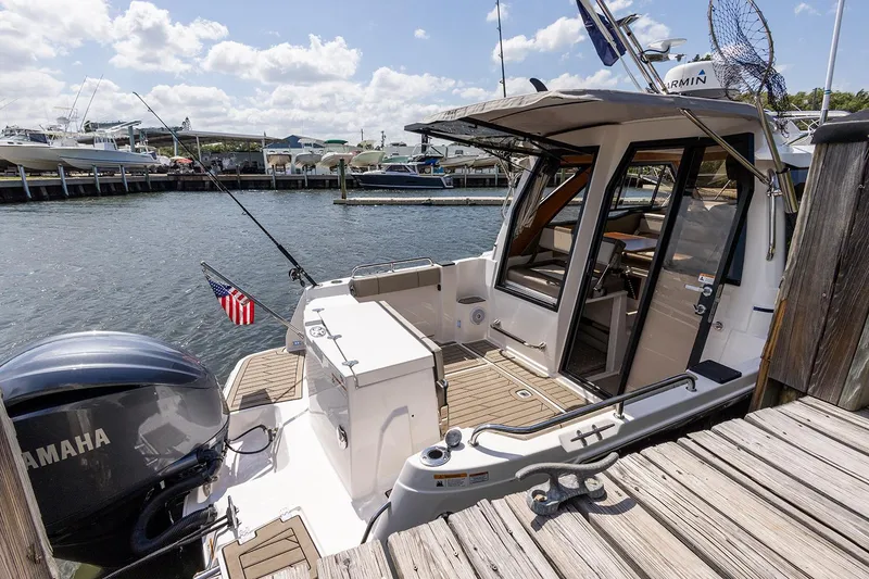 Slide: The Image of Manufacturer Provided Image: 2025 Cutwater C-248 Coupe docked, featuring Yamaha engine and American flag. - 4