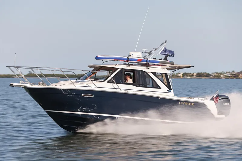 Slide: The Image of Manufacturer Provided Image: 2025 Cutwater C-248 Coupe cruising on open water, side view. - 1
