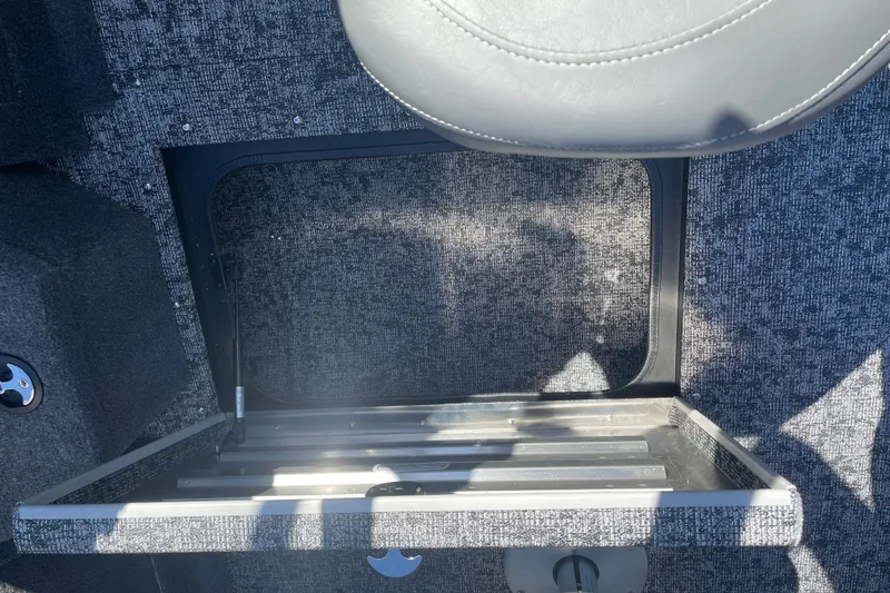 Slide: The Image of 2026 Tracker Pro Guide V-175 WT boat interior storage compartment with gray upholstery. - 14