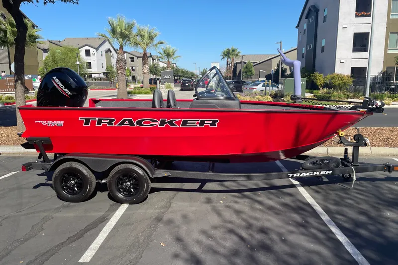 The Image of 2026 Tracker Pro Guide V-175 WT boat in vibrant red on a trailer. - 0