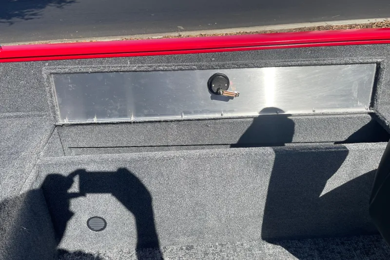 Slide: The Image of 2026 Tracker Pro Guide V-175 WT boat interior with storage compartment and key lock. - 17