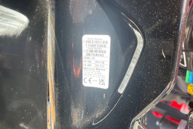 Slide: The Image of Label on 2026 Tracker Pro Guide V-175 WT boat engine, displaying model and serial numbers. - 74