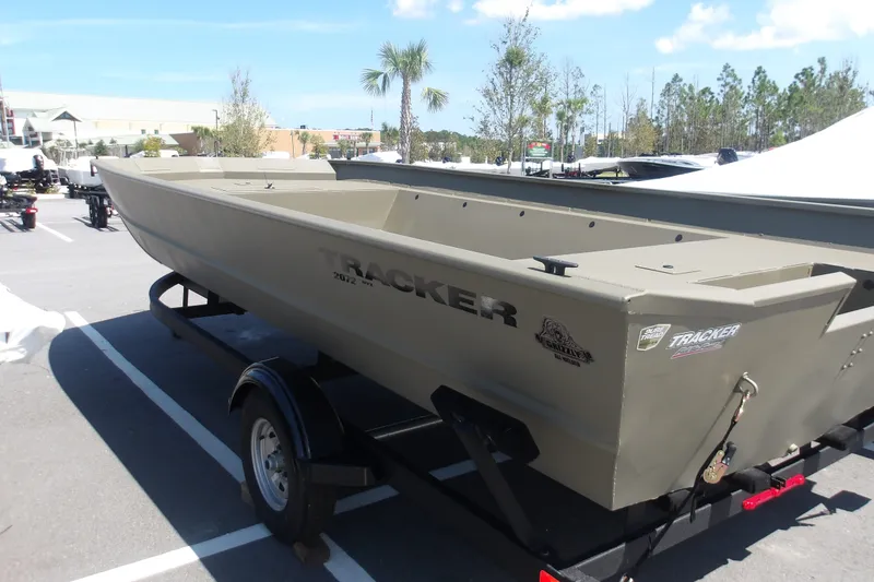 The Image of 2026 Tracker Grizzly 2072 Utility boat on trailer in parking lot. - 0