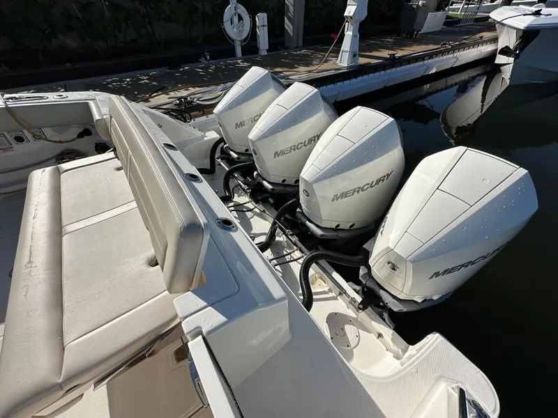 Slide: The Image of 2022 Boston Whaler 380 Realm with four Mercury outboard engines at dockside. - 7