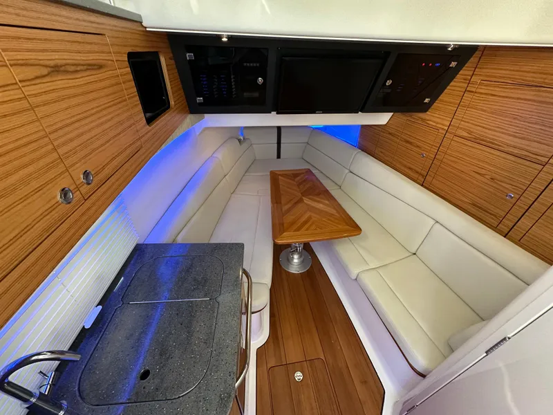 Slide: The Image of Luxurious interior of 2022 Boston Whaler 380 Realm with wood accents and modern amenities. - 30