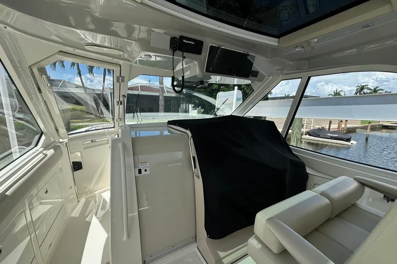 Slide: The Image of Interior view of 2022 Boston Whaler 380 Realm boat, featuring luxurious seating and modern design. - 13