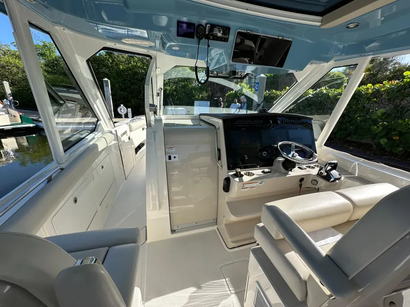 Slide: The Image of 2022 Boston Whaler 380 Realm cockpit with modern controls and seating. - 18