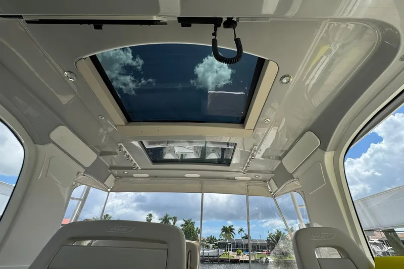 Slide: The Image of Interior view of 2022 Boston Whaler 380 Realm with panoramic sunroof and luxurious seating. - 45