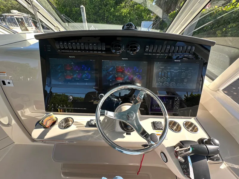 Slide: The Image of Control panel of a 2022 Boston Whaler 380 Realm with advanced navigation displays. - 26
