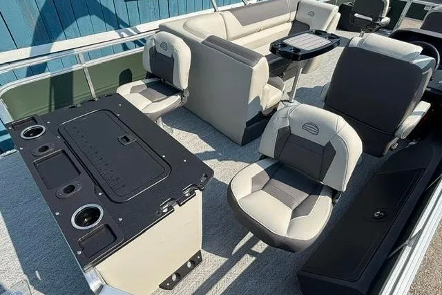 Slide: The Image of 2026 Sun Tracker Fishin' Barge 22 DLX interior with seating and fishing amenities. - 23